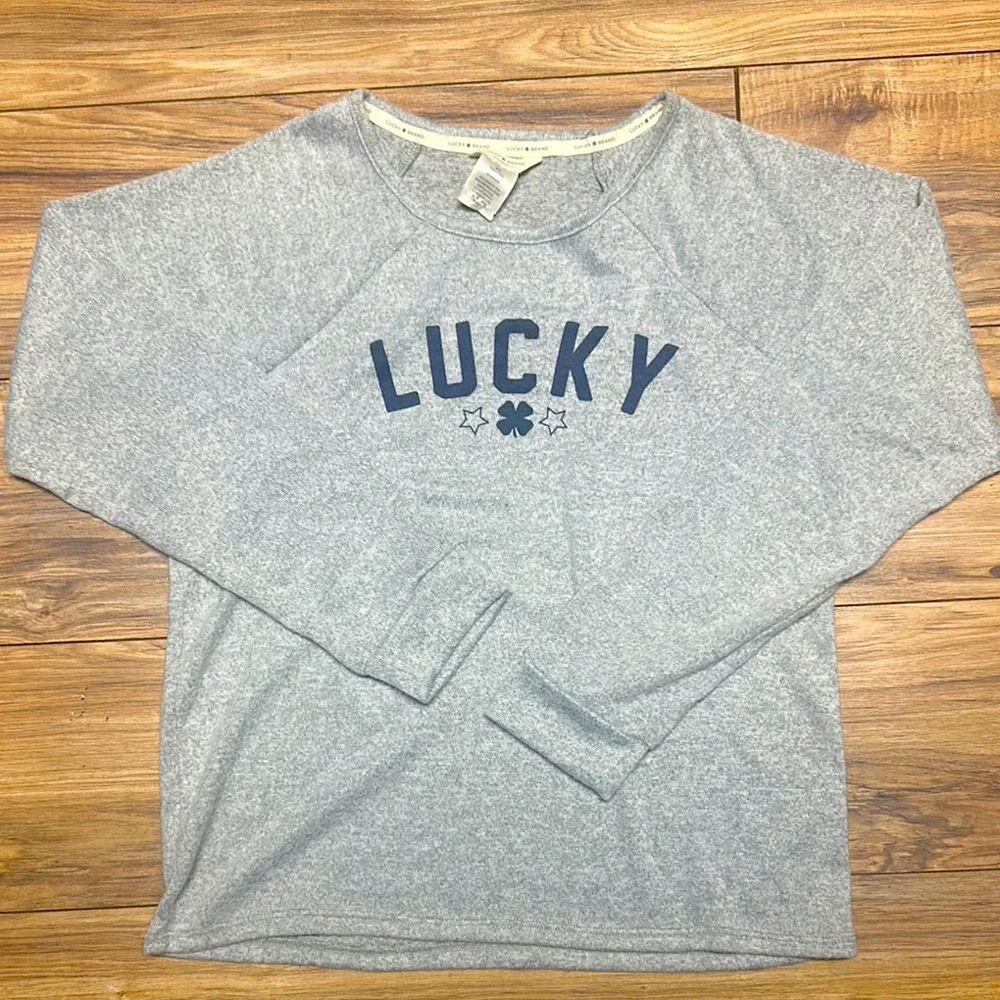NWOT. Woman’s Lucky Brand Gray crewneck Sweater. Size M.